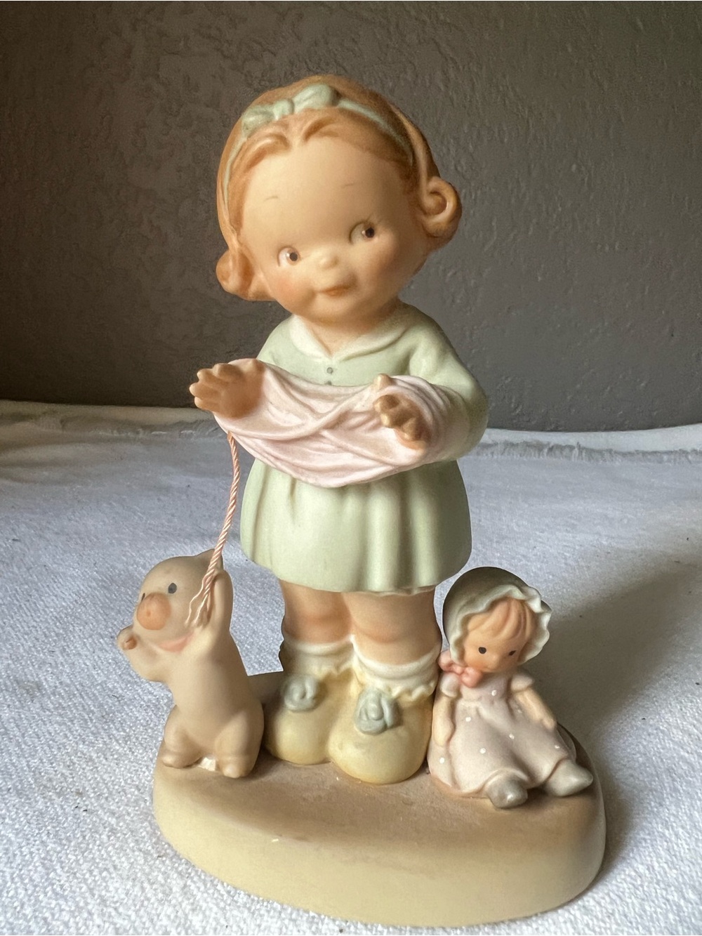Vintage Enesco figurine girl and cat playing with yarn